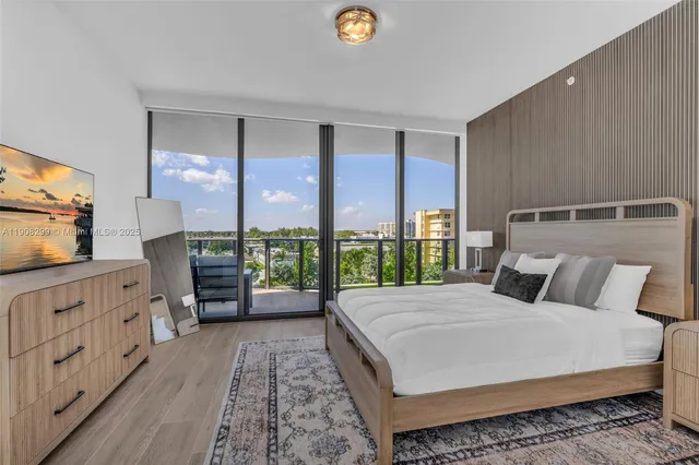 a spacious bathroom with a sink a mirror a bathtub and shower