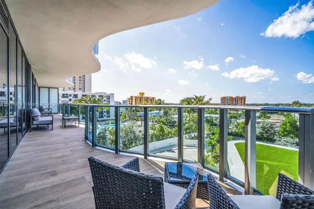 a view of a balcony with an ocean view