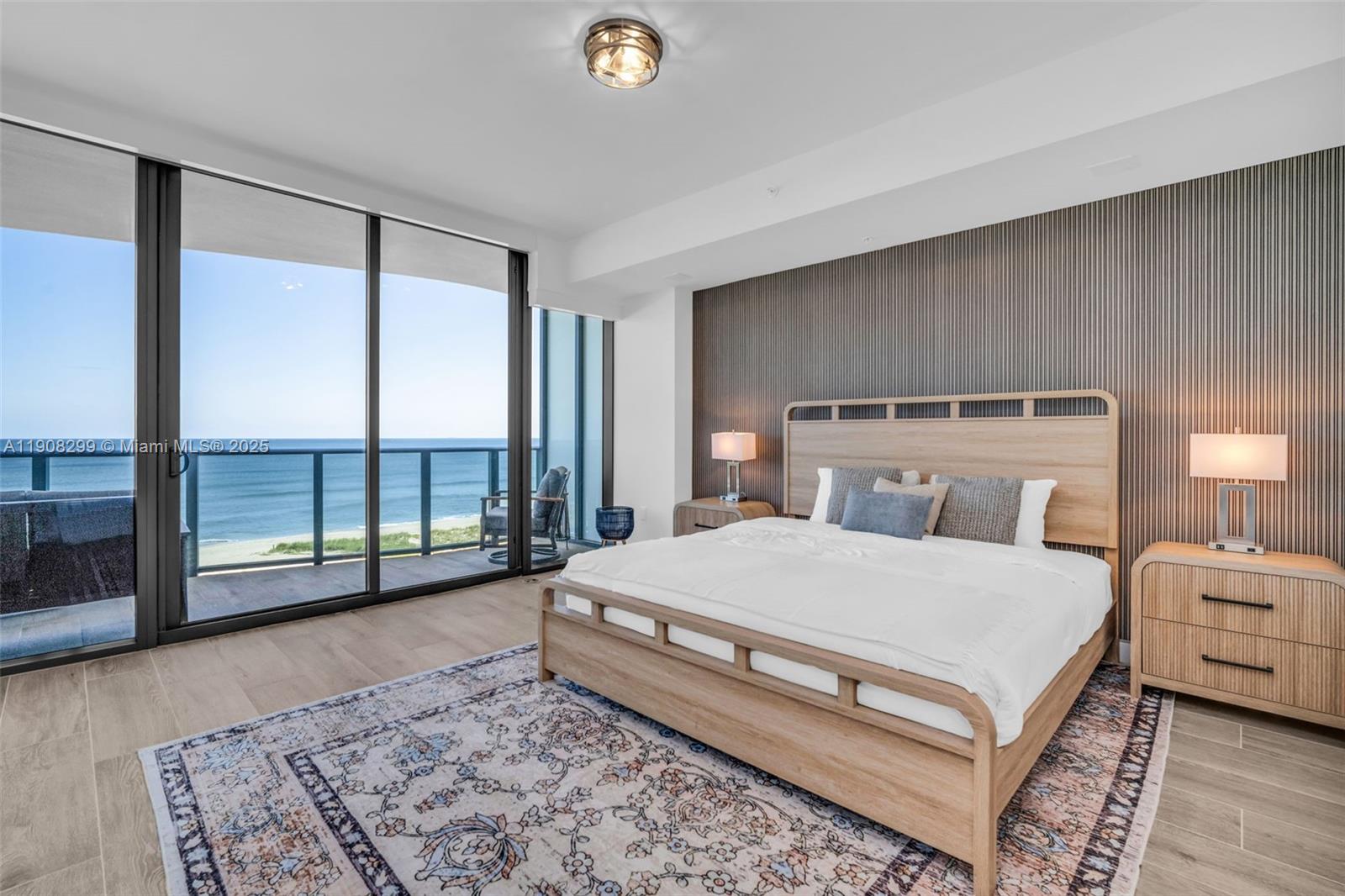 900 North Ocean Boulevard, Unit 503 Pompano Beach, FL 33062 - Photo 39 of 99 a spacious bedroom with a bed and large window