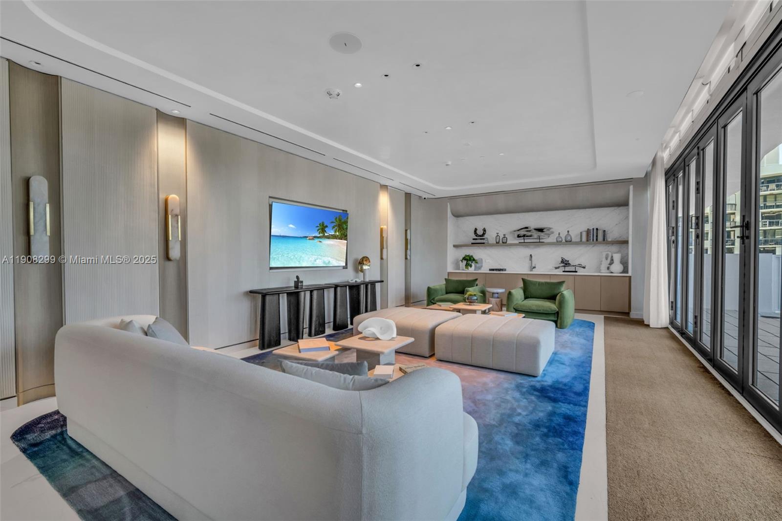 900 North Ocean Boulevard, Unit 503 Pompano Beach, FL 33062 - Photo 73 of 99 a living room with furniture a window and a flat screen tv