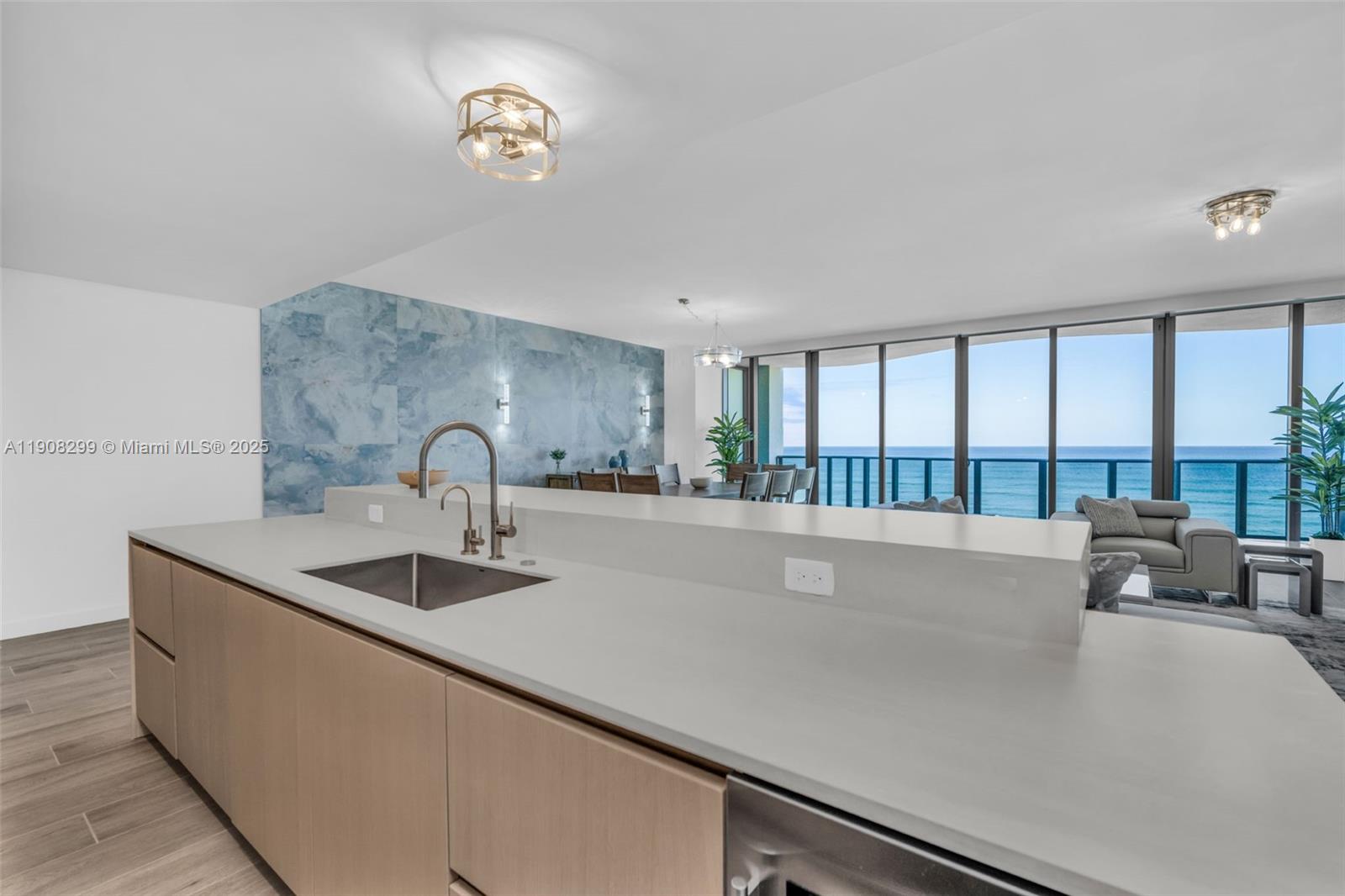 900 North Ocean Boulevard, Unit 503 Pompano Beach, FL 33062 - Photo 8 of 99 a kitchen with a sink and a large window