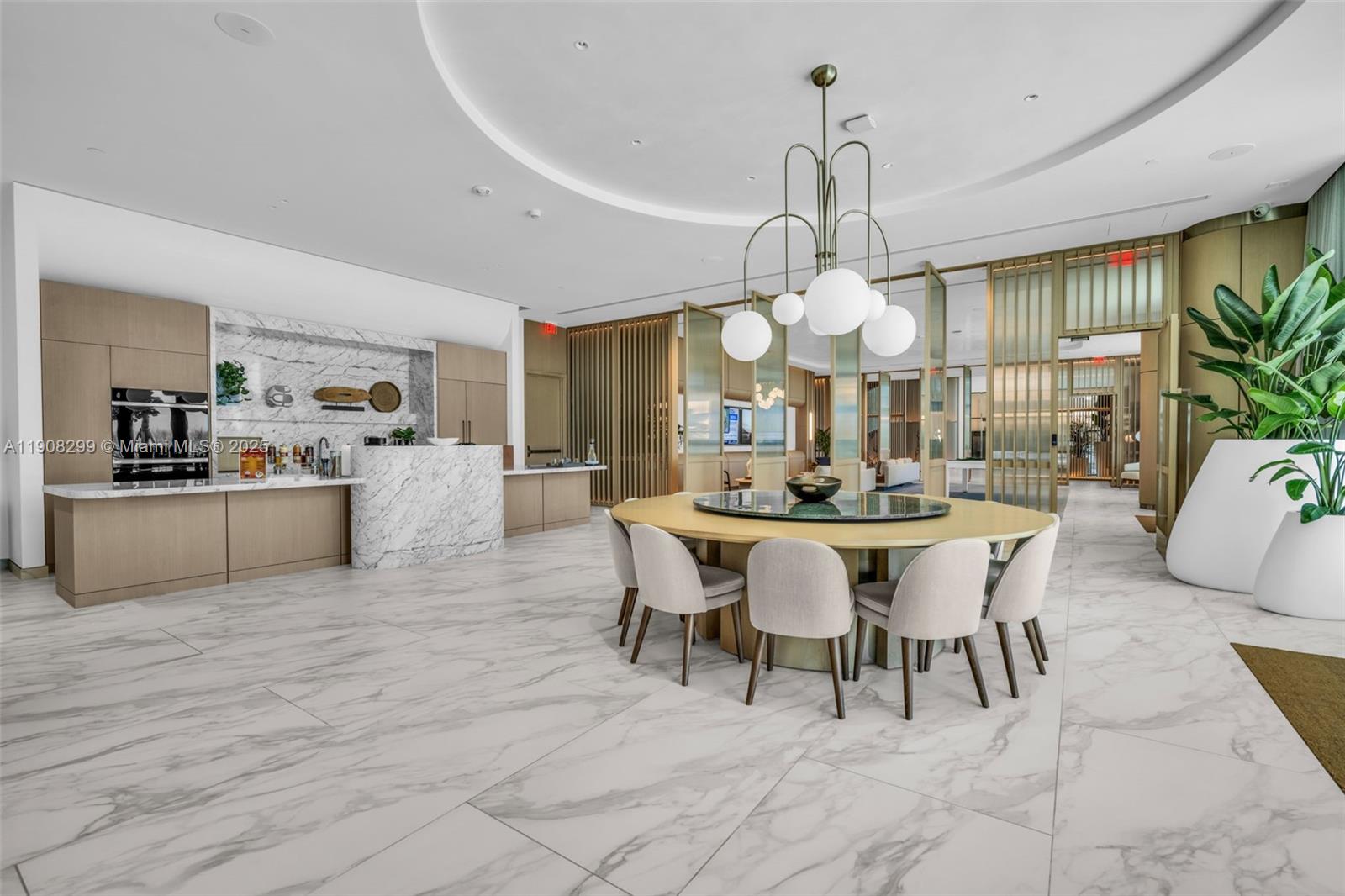 900 North Ocean Boulevard, Unit 503 Pompano Beach, FL 33062 - Photo 86 of 99 a view of a dining room with furniture and chandelier
