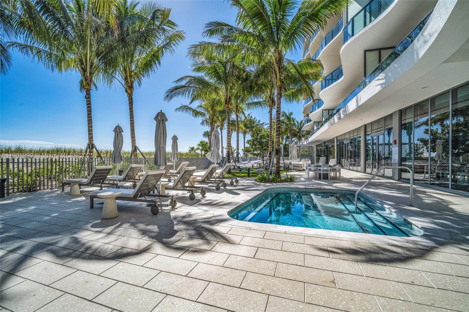 900 North Ocean Boulevard, Unit 503 Pompano Beach, FL 33062 - Photo 98 of 99 a view of swimming pool with outdoor seating and plants
