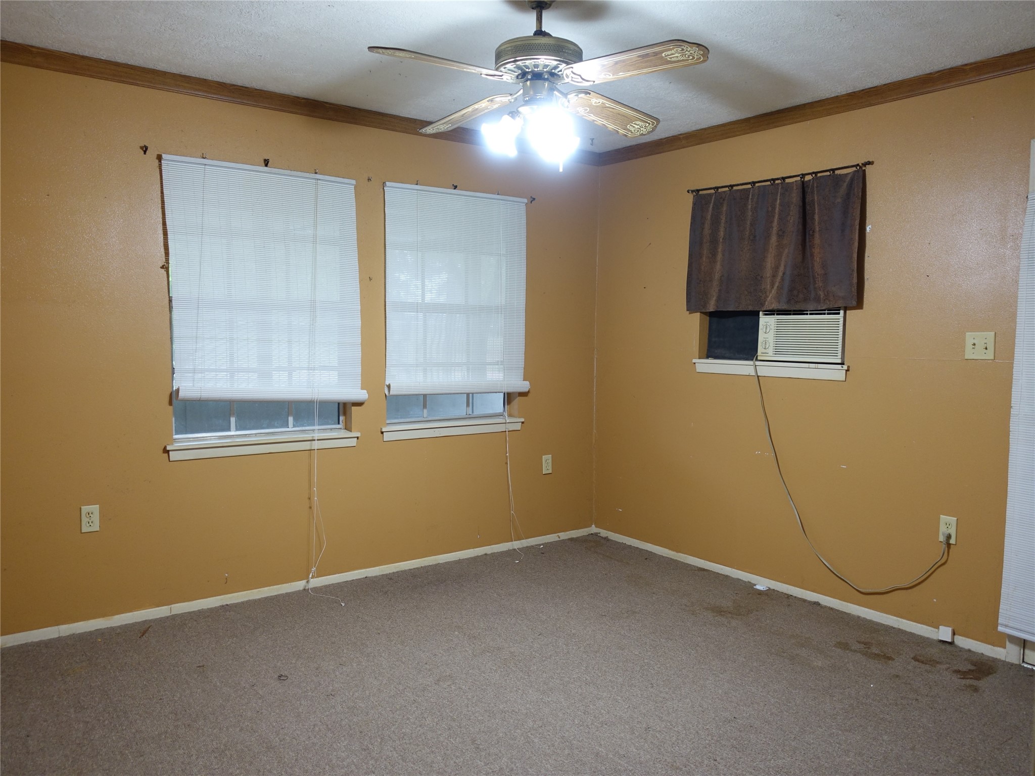 20 Hideaway Trail Coldspring, TX 77331 - Photo 15 of 24 a view of an empty room with window and chandelier fan