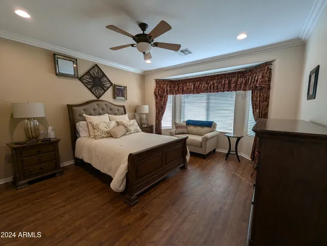 a spacious bathroom with double vanity and a mirror