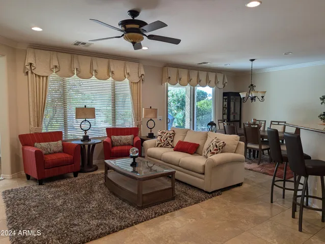 a view of a dining room with furniture and window