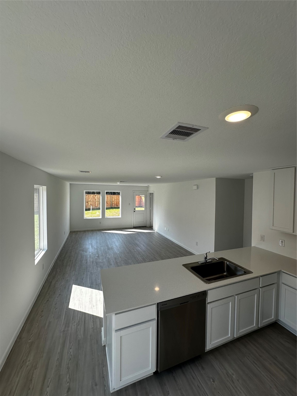 6007 Patriot Sound Road Humble, TX 77338 - Photo 5 of 34 a living room with stainless steel appliances kitchen island hardwood floor and a sink