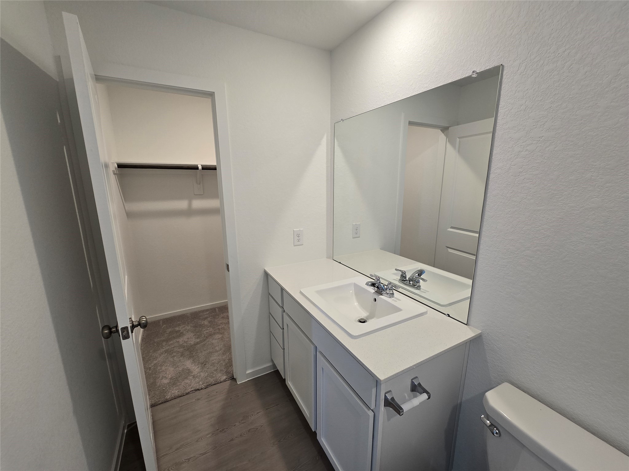 6007 Patriot Sound Road Humble, TX 77338 - Photo 9 of 34 a bathroom with a sink a toilet and vanity