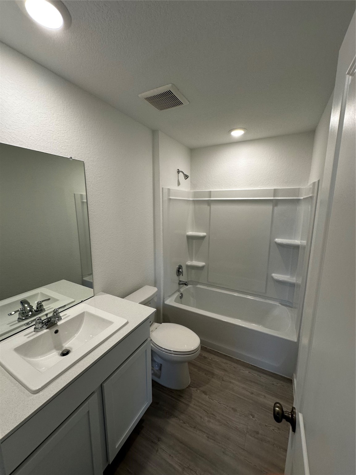 6007 Patriot Sound Road Humble, TX 77338 - Photo 12 of 34 a bathroom with a sink a toilet and shower