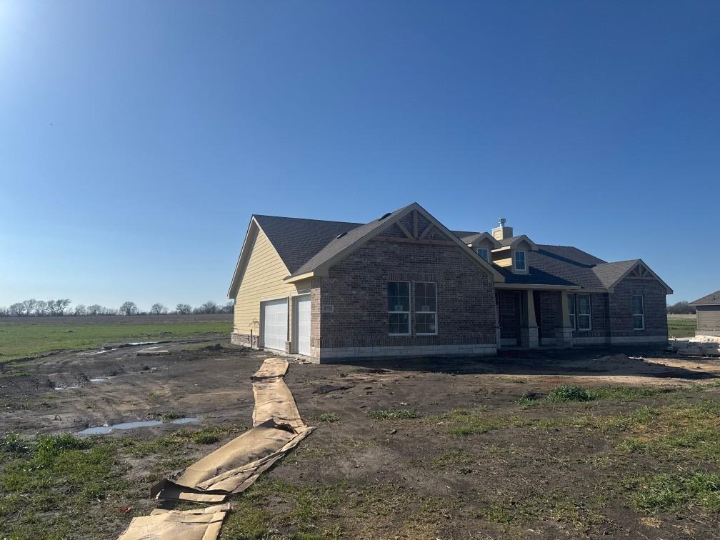 8755 County Road 623 Blue Ridge, TX 75424 - Photo 3 of 15 a front view of a house with a yard