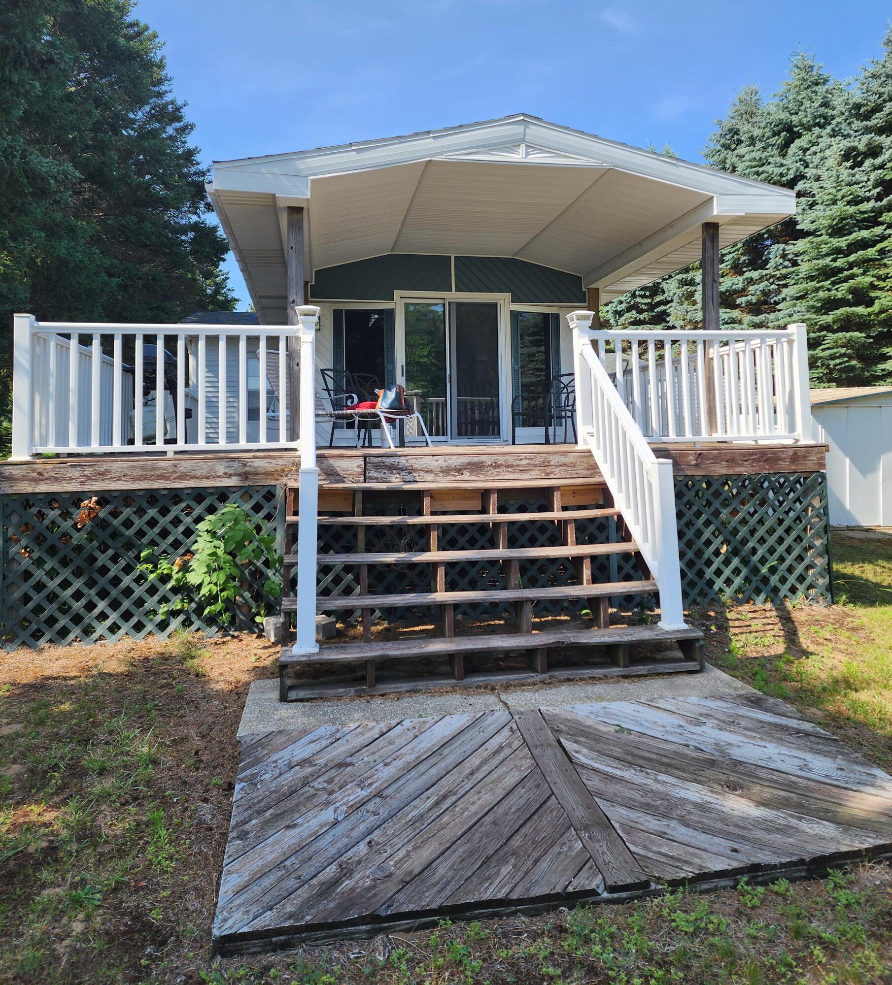 7951 West Village Road Mears, MI 49436 - Photo 1 of 3 Covered Deck