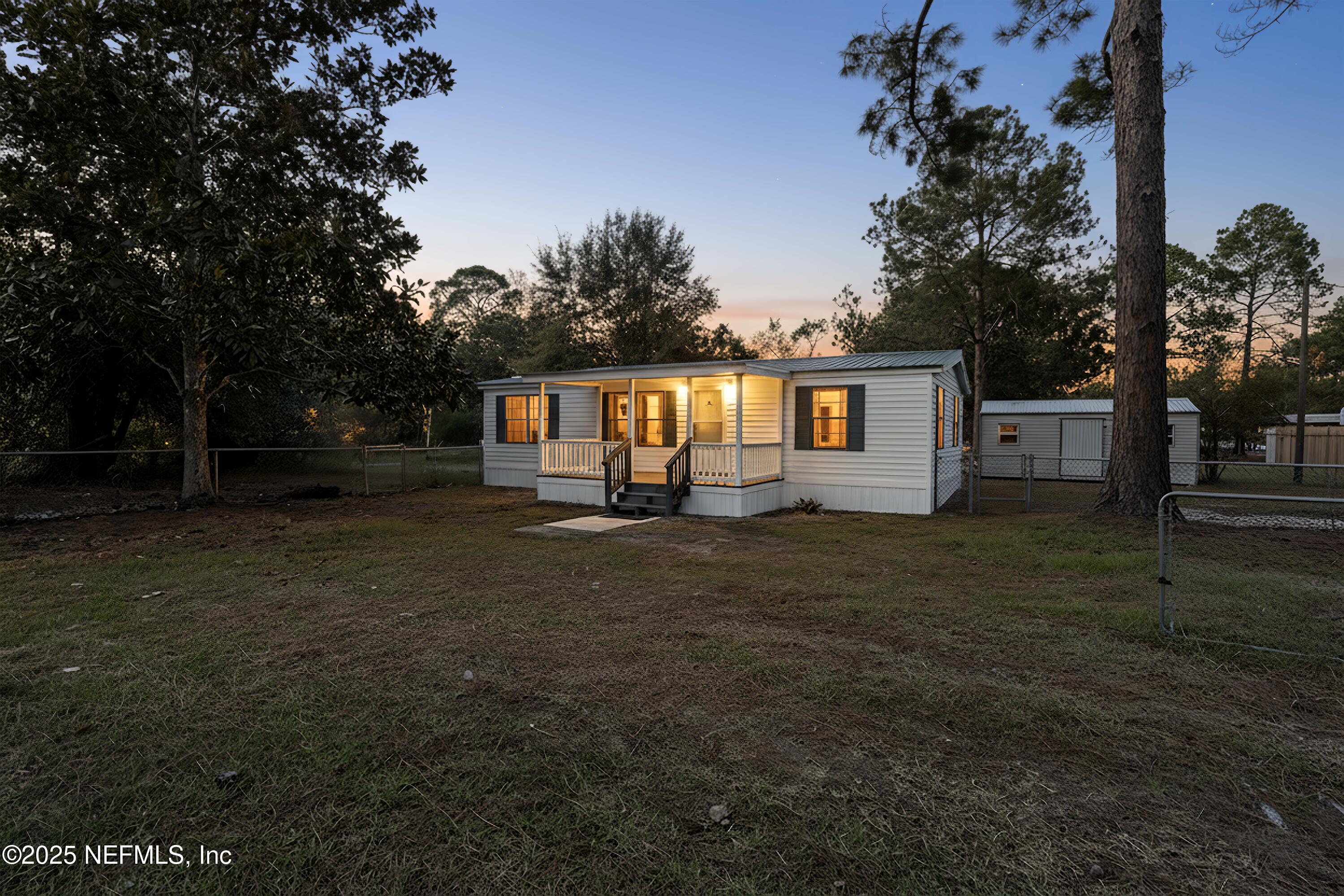 6480 Keith Griffis Circle Macclenny, FL 32063 - Photo 1 of 50 a front view of a house with garden