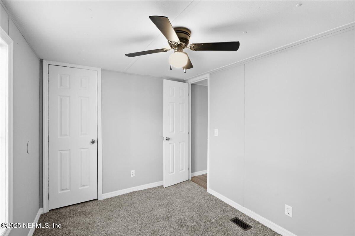 6480 Keith Griffis Circle Macclenny, FL 32063 - Photo 21 of 50 an empty room with ceiling fan
