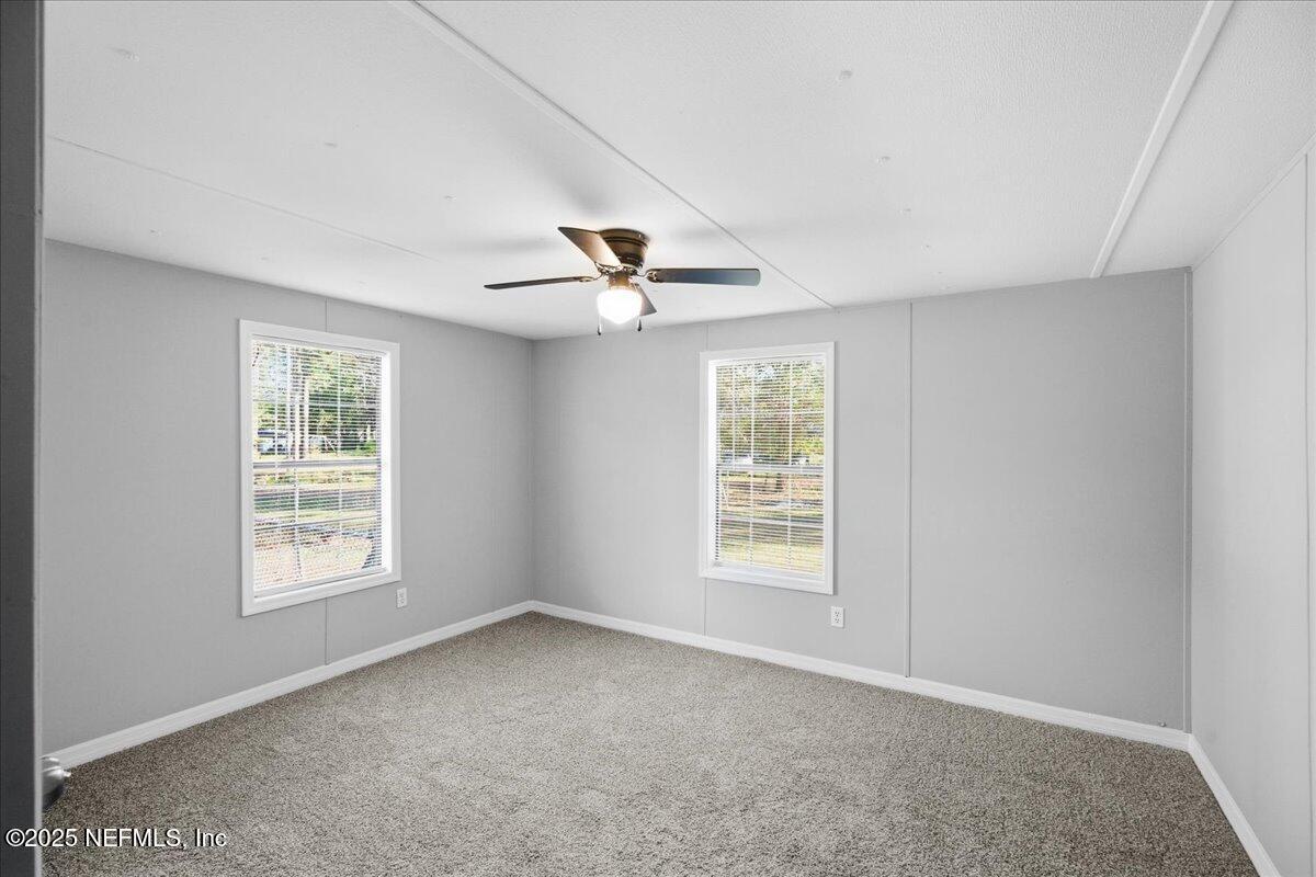 6480 Keith Griffis Circle Macclenny, FL 32063 - Photo 23 of 50 a view of an empty room with a window