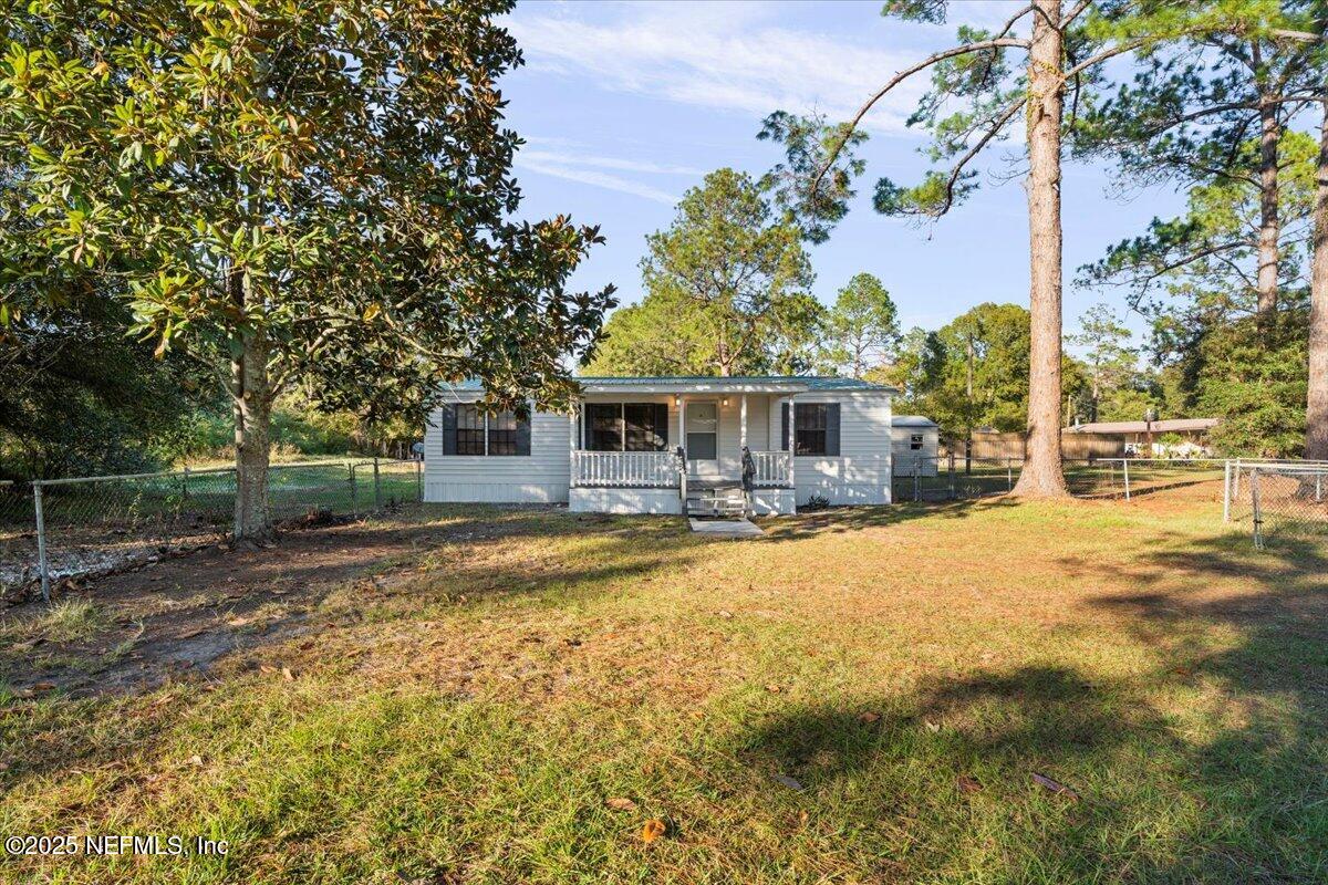 6480 Keith Griffis Circle Macclenny, FL 32063 - Photo 3 of 50 a house with swimming pool in front of it