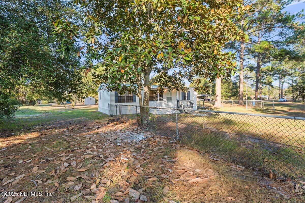 6480 Keith Griffis Circle Macclenny, FL 32063 - Photo 33 of 50 a backyard of a house with lots of green space