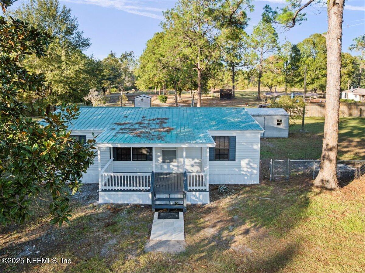 6480 Keith Griffis Circle Macclenny, FL 32063 - Photo 34 of 50 front view of a house with a yard