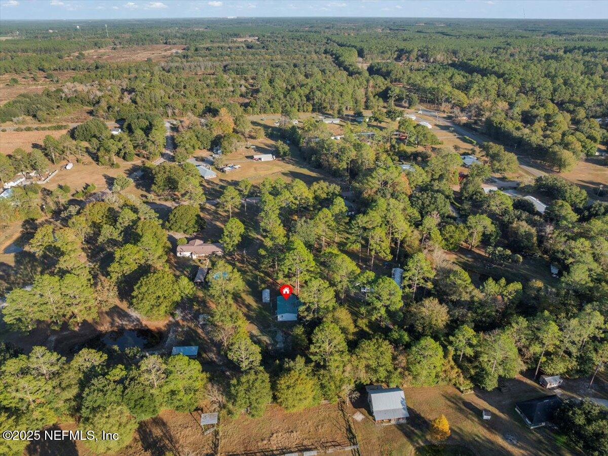 6480 Keith Griffis Circle Macclenny, FL 32063 - Photo 45 of 50 an aerial view of residential houses with outdoor space and trees