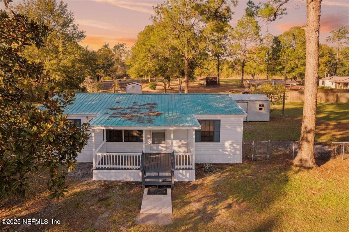 6480 Keith Griffis Circle Macclenny, FL 32063 - Photo 49 of 50 an aerial view of a house with a yard