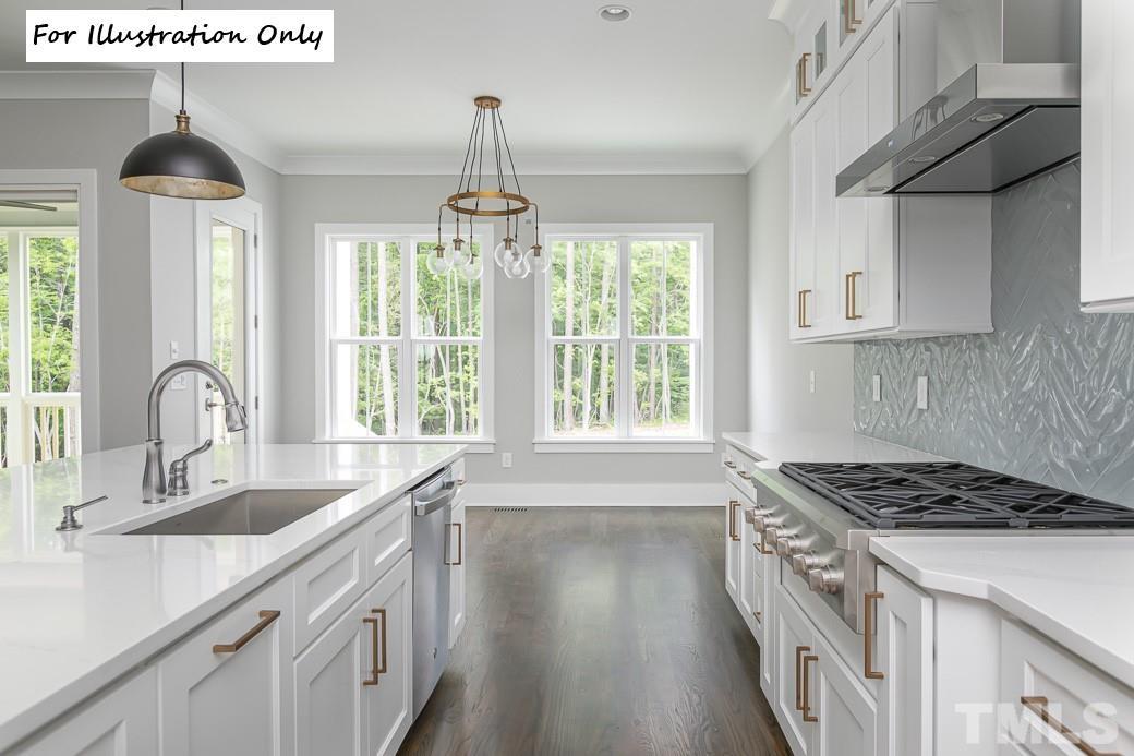 2309 Sanctuary Drive Raleigh, NC 27606 - Photo 12 of 22 a kitchen with stainless steel appliances granite countertop a sink stove and refrigerator