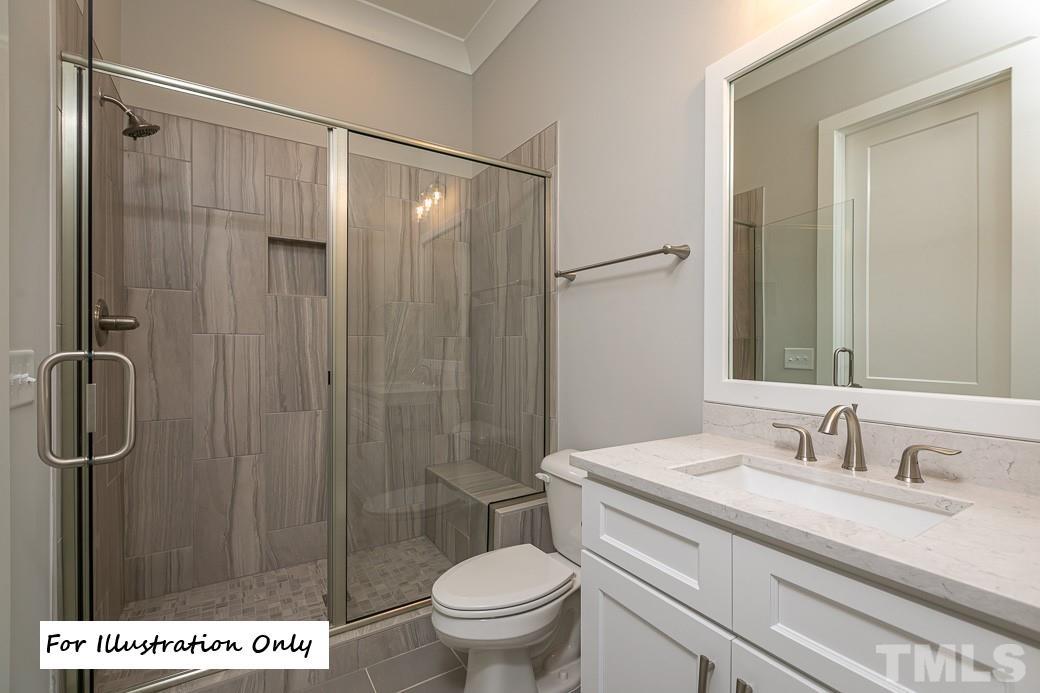 2309 Sanctuary Drive Raleigh, NC 27606 - Photo 20 of 22 a bathroom with a sink a toilet and shower