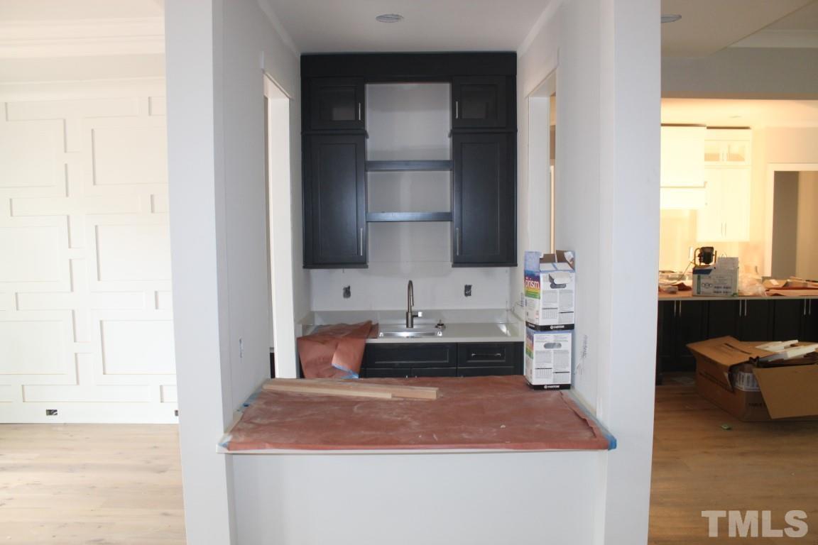 2309 Sanctuary Drive Raleigh, NC 27606 - Photo 4 of 22 a room with a sink and a mirror