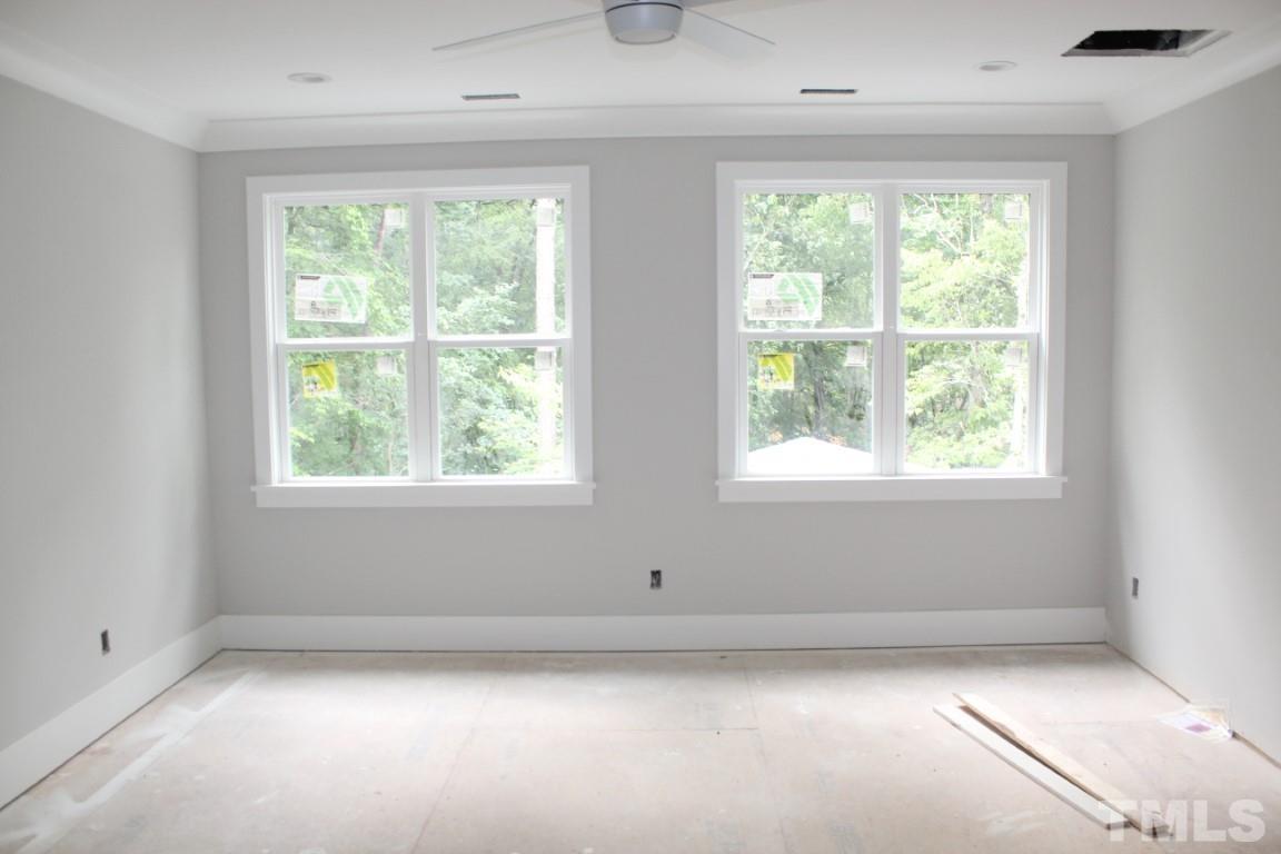 2309 Sanctuary Drive Raleigh, NC 27606 - Photo 7 of 22 an empty room with windows