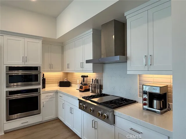 a kitchen with granite countertop a stove and a sink