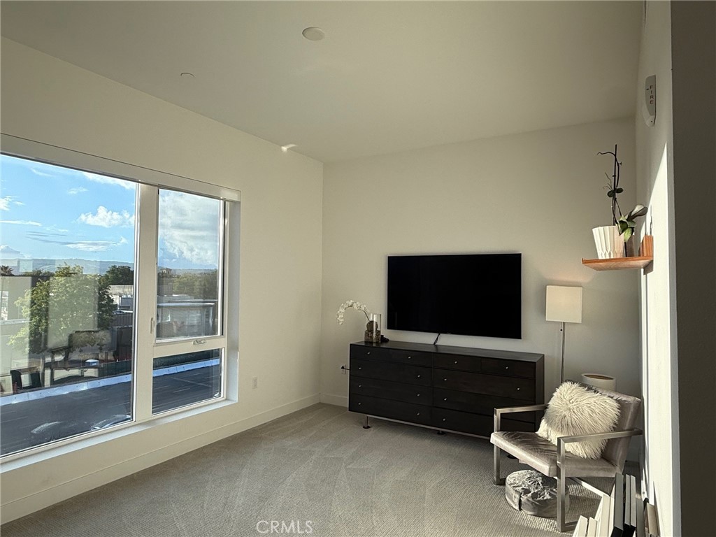 3414 Rivington Irvine, CA 92612 - Photo 29 of 33 a living room with furniture and a flat screen tv