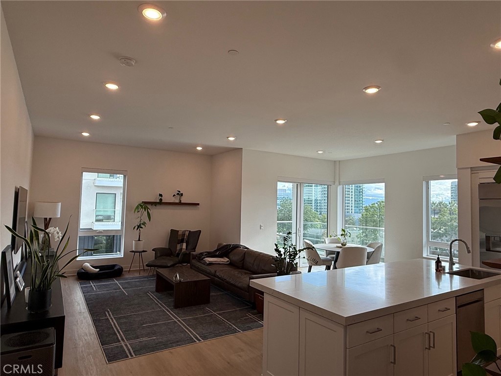 3414 Rivington Irvine, CA 92612 - Photo 3 of 33 a living room with lots of furniture a potted plant and open kitchen view