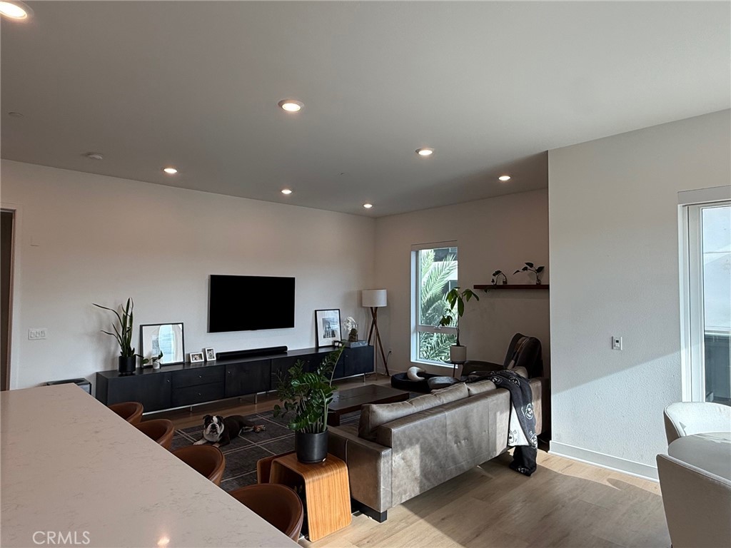 3414 Rivington Irvine, CA 92612 - Photo 9 of 33 a living room with furniture and a flat screen tv