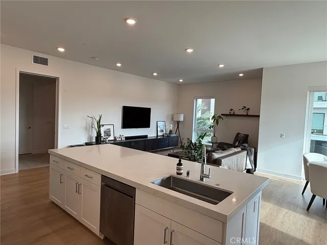 a kitchen with a sink and a refrigerator