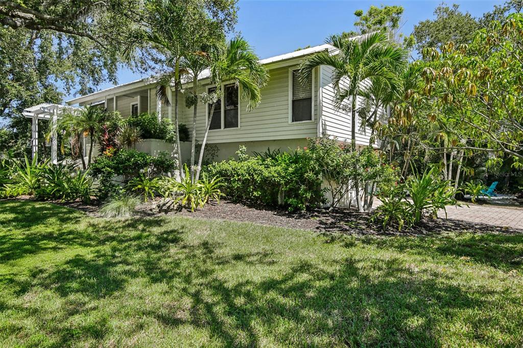 3390 Bayou Sound Longboat Key, FL 34228 - Photo 1 of 59 a view of a house with a yard and plants