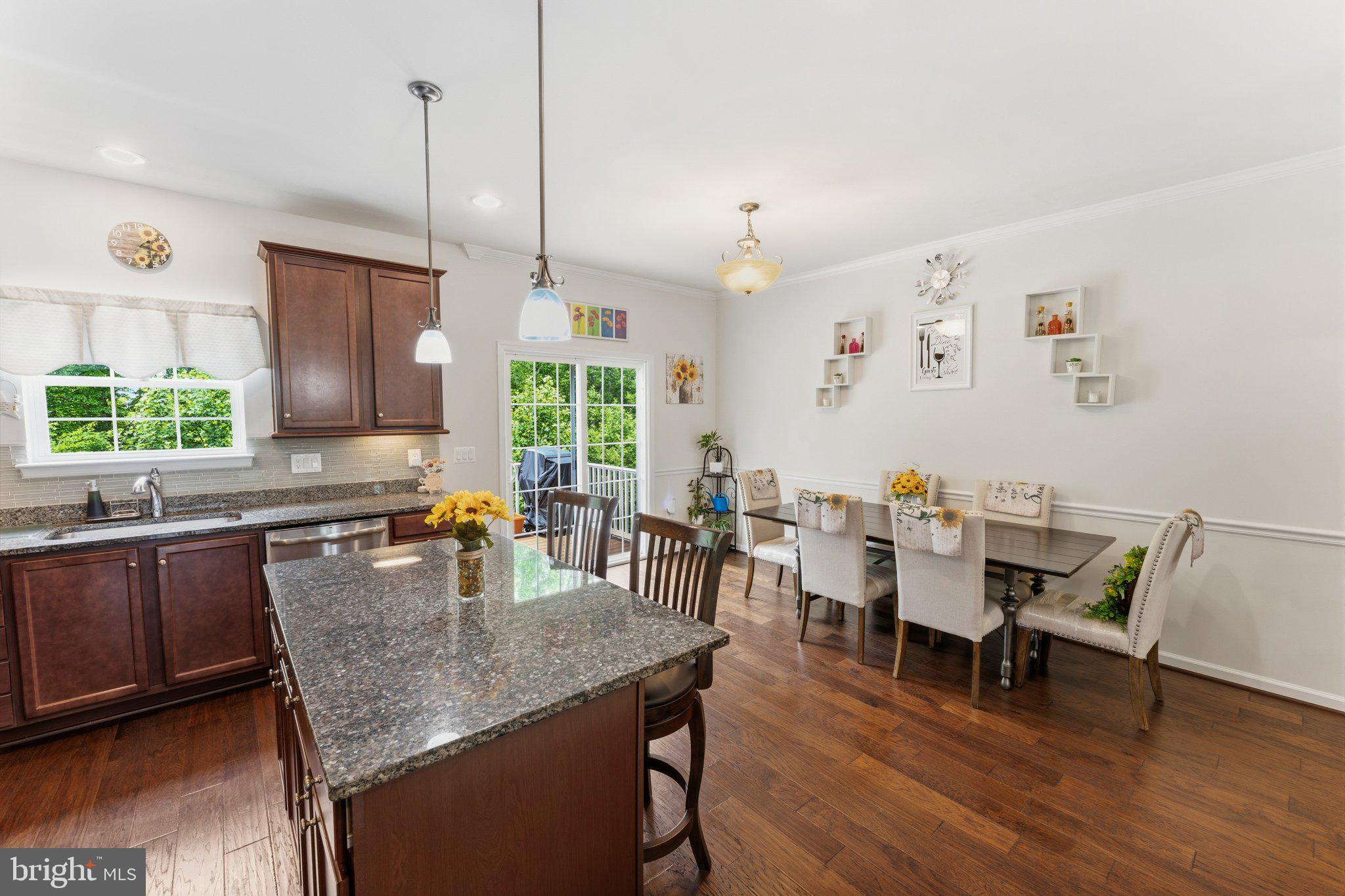 320 Tree Line Drive Fredericksburg, VA 22405 - Photo 17 of 49 a dining room with furniture a chandelier and wooden floor