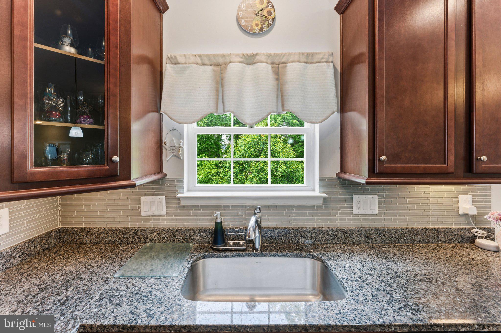 320 Tree Line Drive Fredericksburg, VA 22405 - Photo 18 of 49 a kitchen with granite countertop a sink and a window
