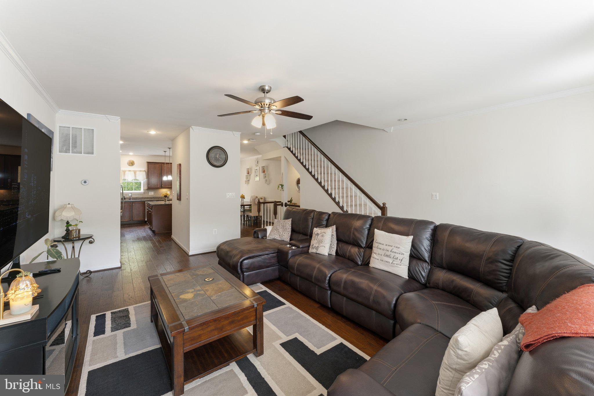 320 Tree Line Drive Fredericksburg, VA 22405 - Photo 26 of 49 a living room with furniture and a chandelier