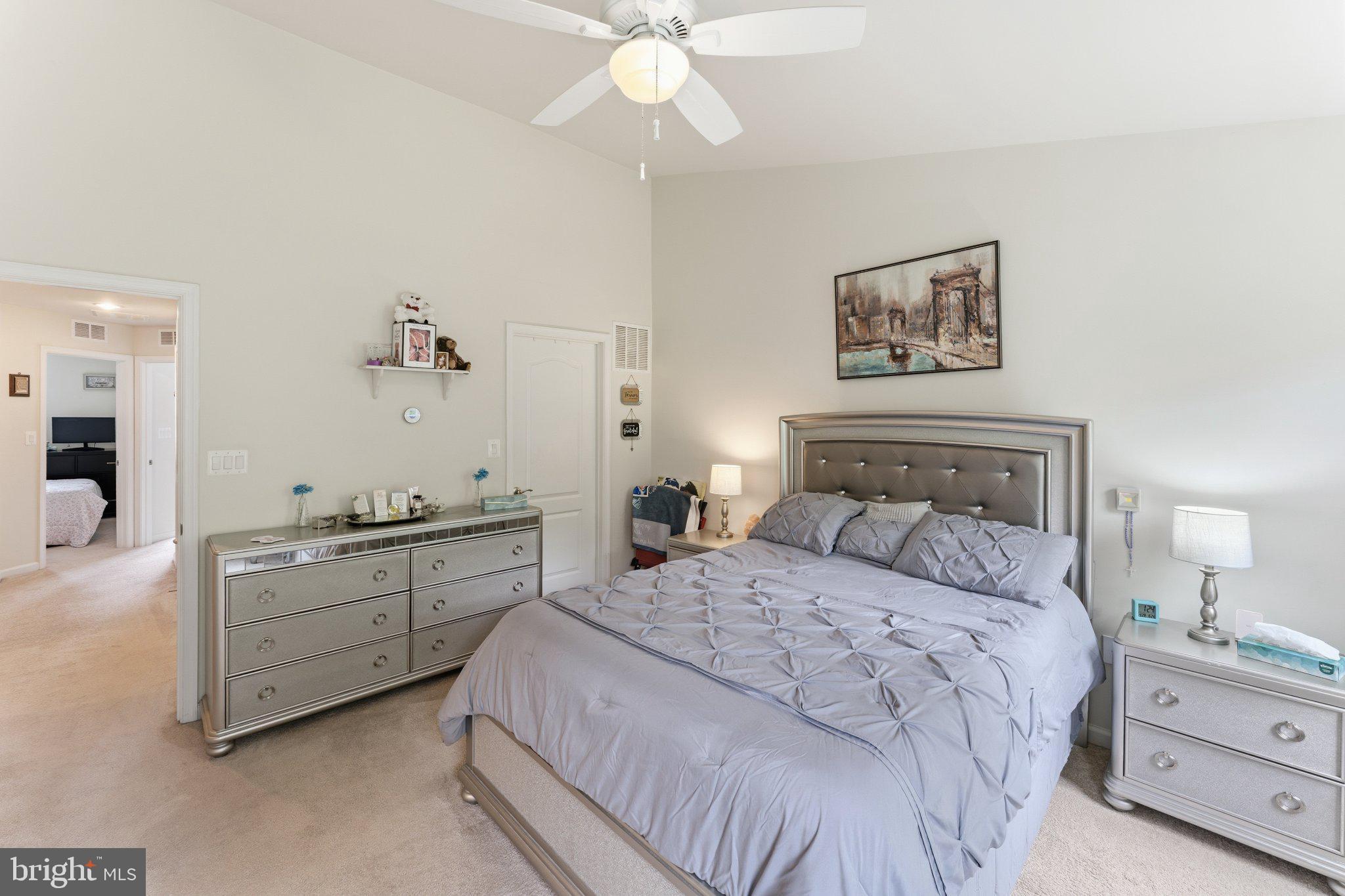 320 Tree Line Drive Fredericksburg, VA 22405 - Photo 30 of 49 a bedroom with a bed and a chandelier