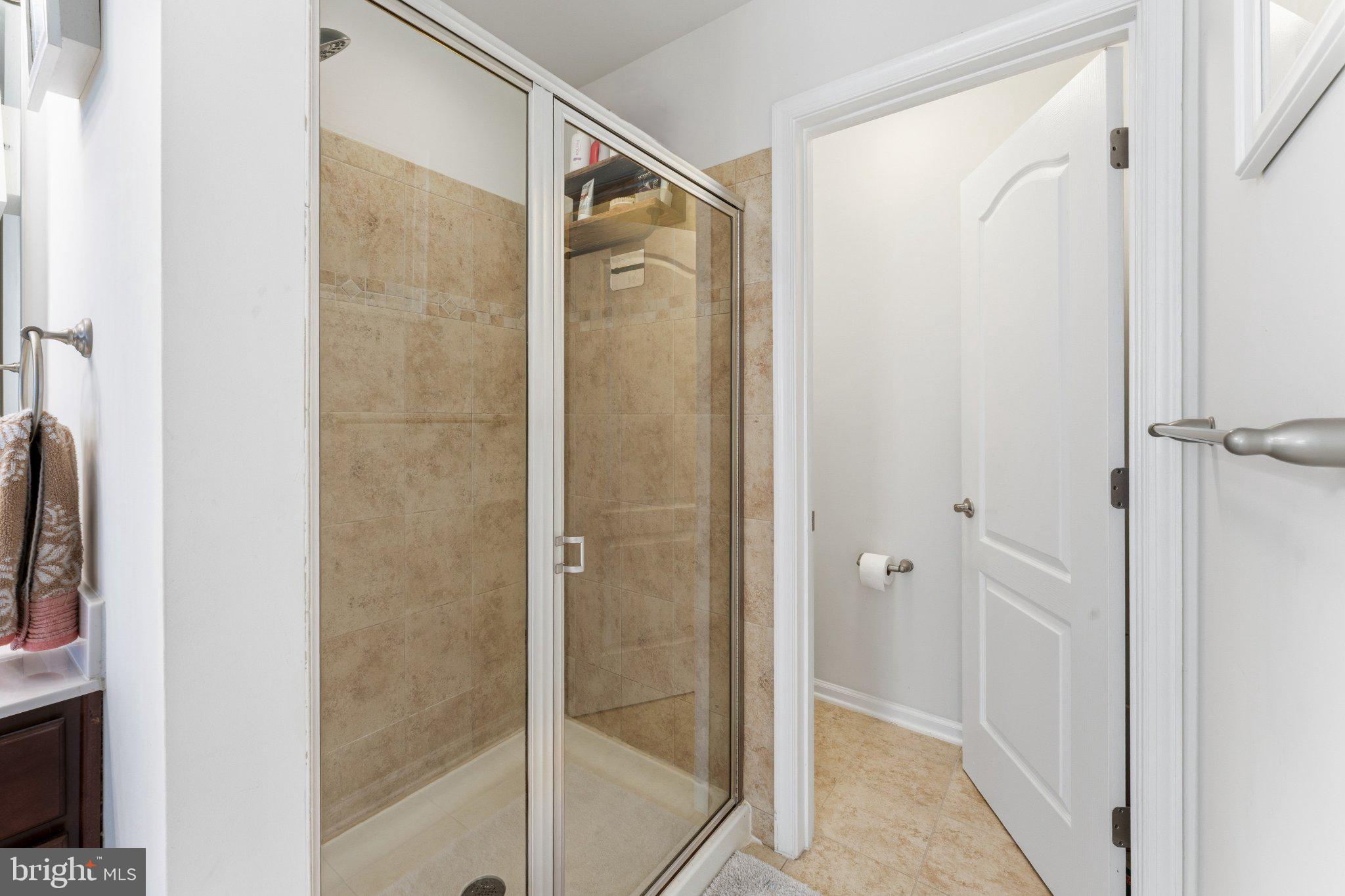 320 Tree Line Drive Fredericksburg, VA 22405 - Photo 32 of 49 a bathroom with a glass shower door