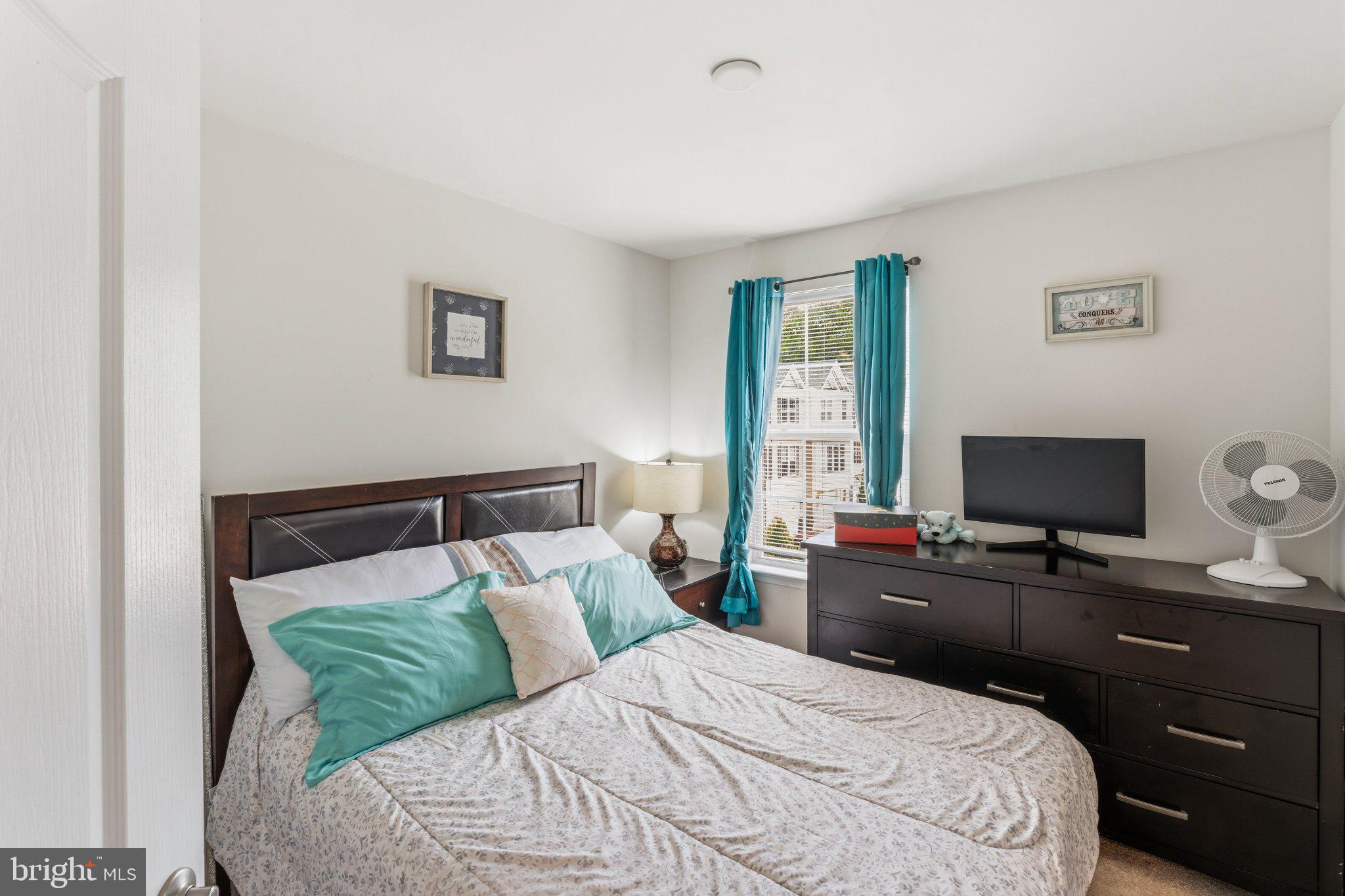 320 Tree Line Drive Fredericksburg, VA 22405 - Photo 34 of 49 a bedroom with a bed and a flat screen tv