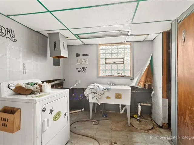 a utility room with washer and dryer