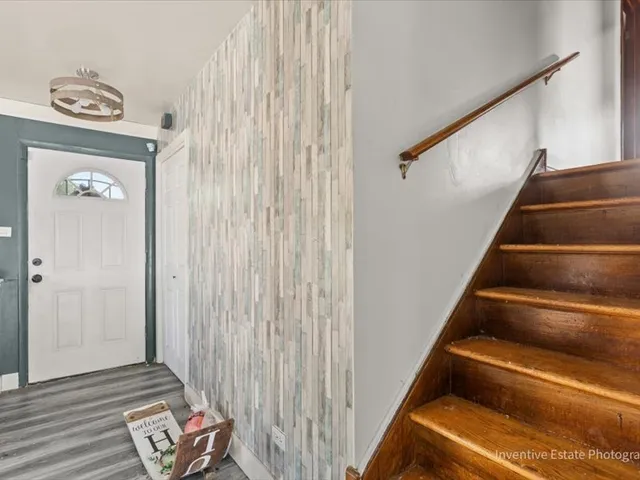 a view of entryway with wooden floor