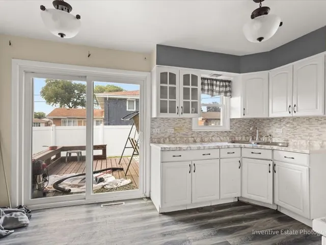 a kitchen with stainless steel appliances granite countertop a stove and a sink