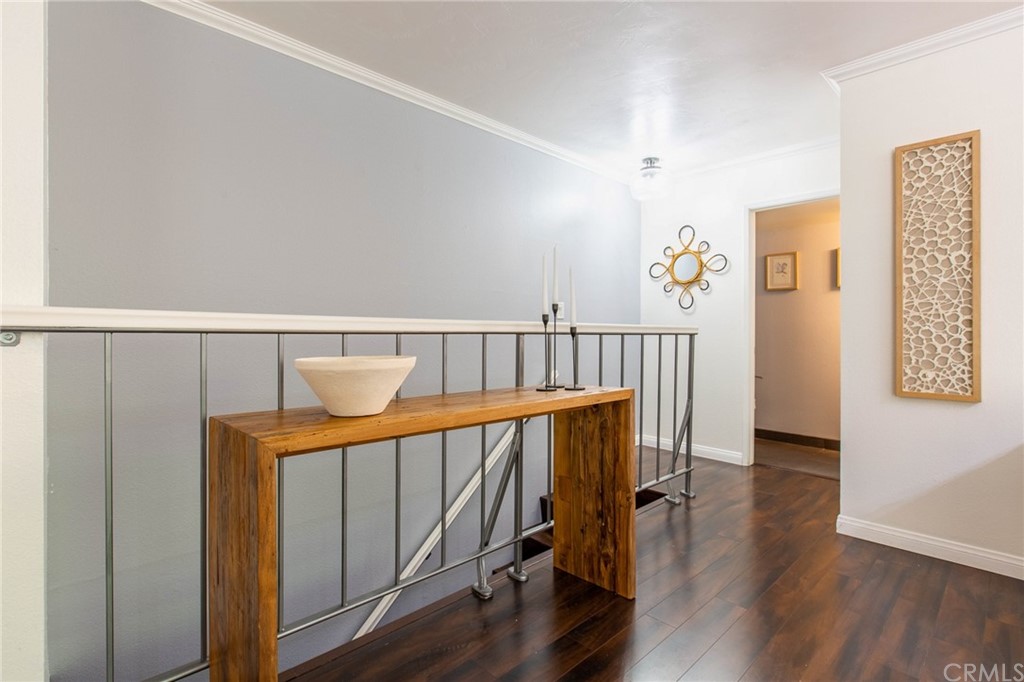 1881 Alpha Road, Unit 5 Glendale, CA 91208 - Photo 11 of 29 a view of hallway with furniture and wooden floor