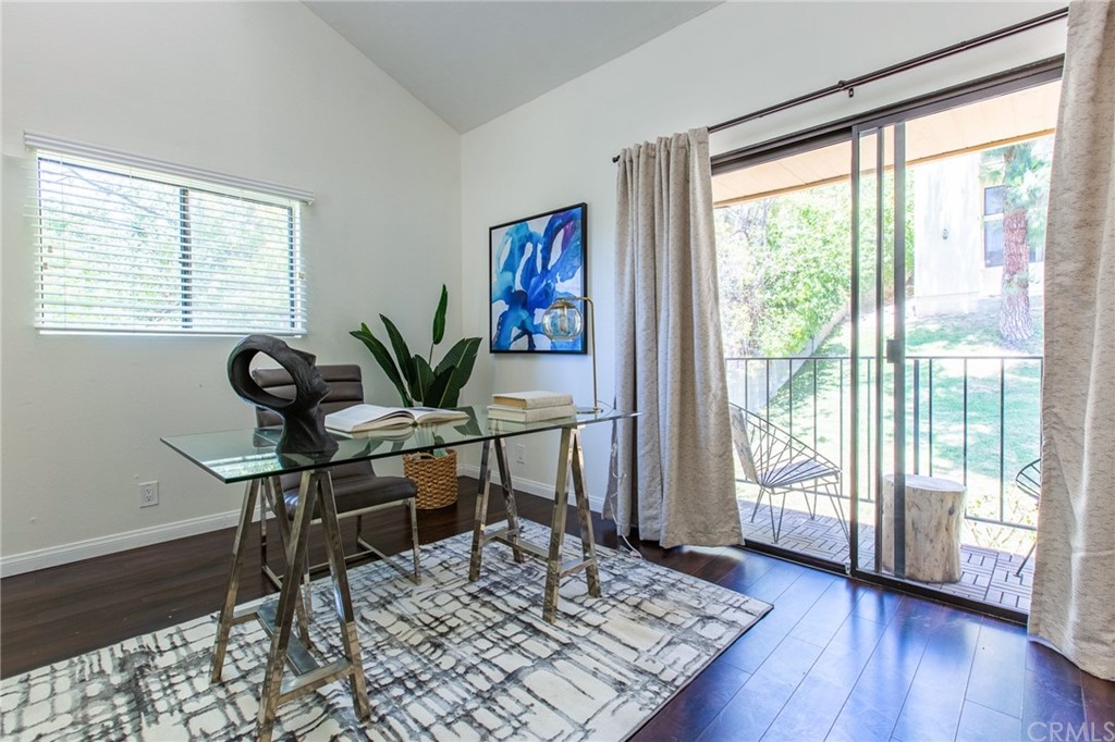 1881 Alpha Road, Unit 5 Glendale, CA 91208 - Photo 19 of 29 a view of a livingroom with furniture and a table