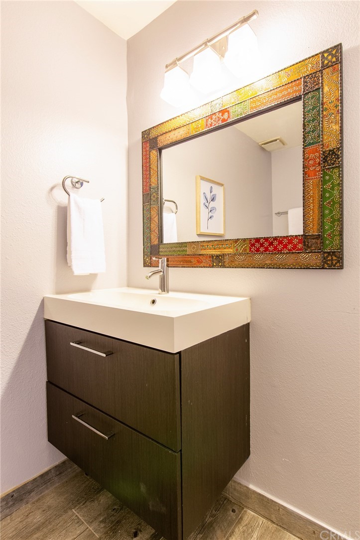 1881 Alpha Road, Unit 5 Glendale, CA 91208 - Photo 20 of 29 a bathroom with a sink vanity and a mirror