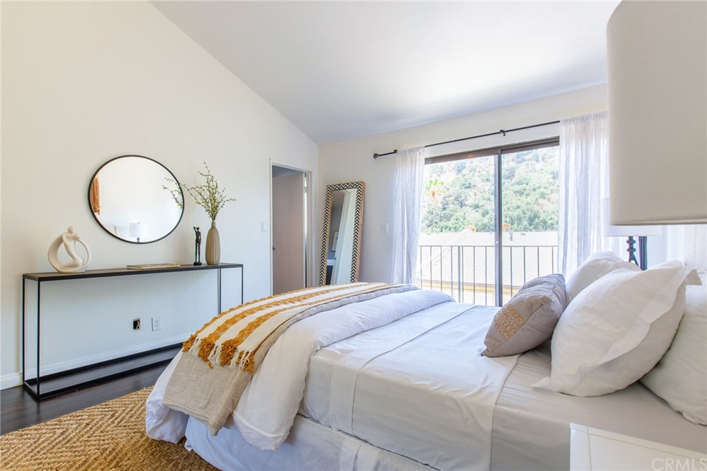 1881 Alpha Road, Unit 5 Glendale, CA 91208 - Photo 22 of 29 a bedroom with a bed and window