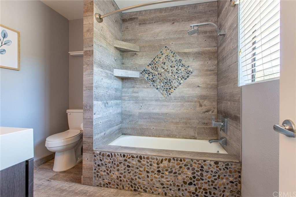 1881 Alpha Road, Unit 5 Glendale, CA 91208 - Photo 25 of 29 a bathroom with a shower and a toilet