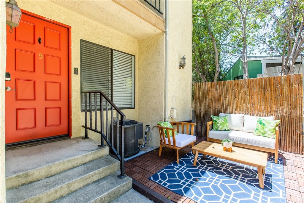 1881 Alpha Road, Unit 5 Glendale, CA 91208 - Photo 27 of 29 a balcony with chairs and a rug