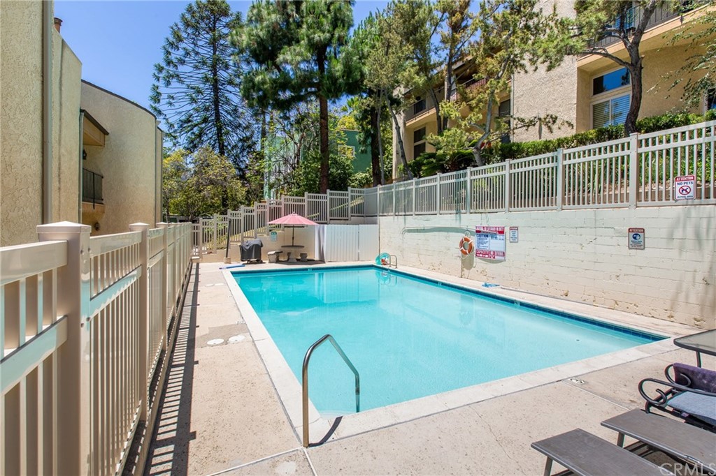1881 Alpha Road, Unit 5 Glendale, CA 91208 - Photo 28 of 29 a view of a swimming pool with an outdoor seating
