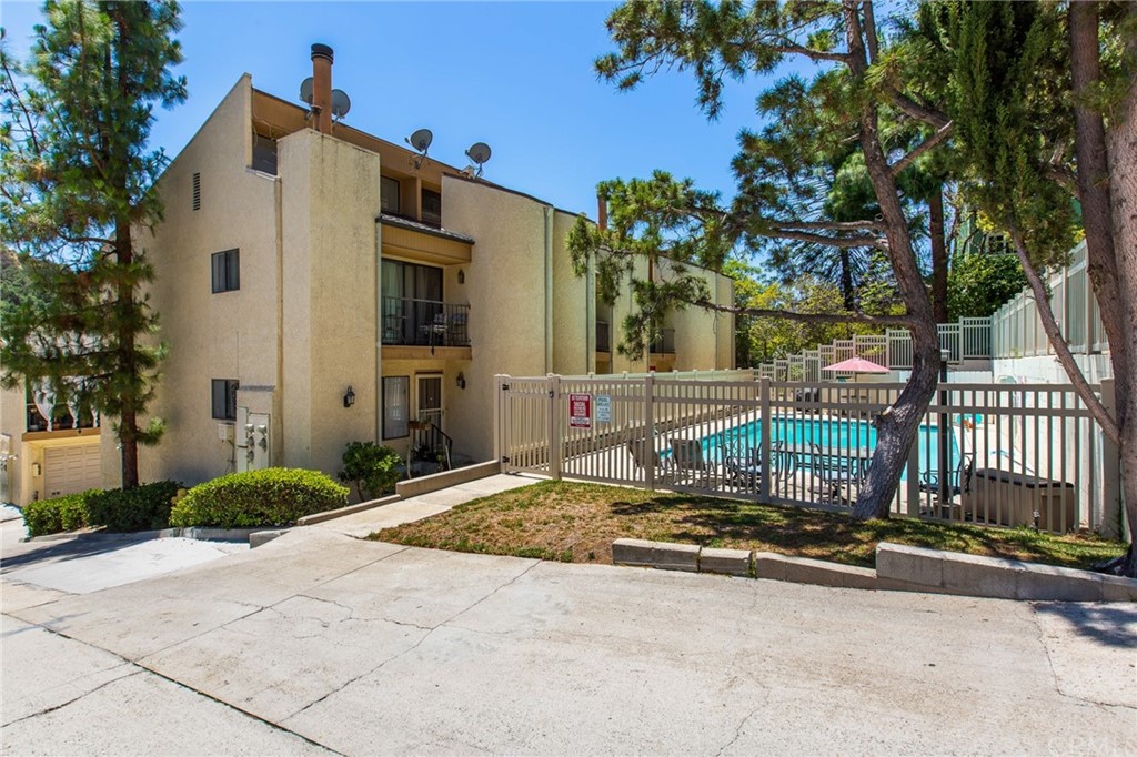 1881 Alpha Road, Unit 5 Glendale, CA 91208 - Photo 29 of 29 a front view of a house with porch